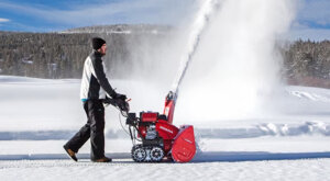 Man cleaning out the snow with his Honda snowblower