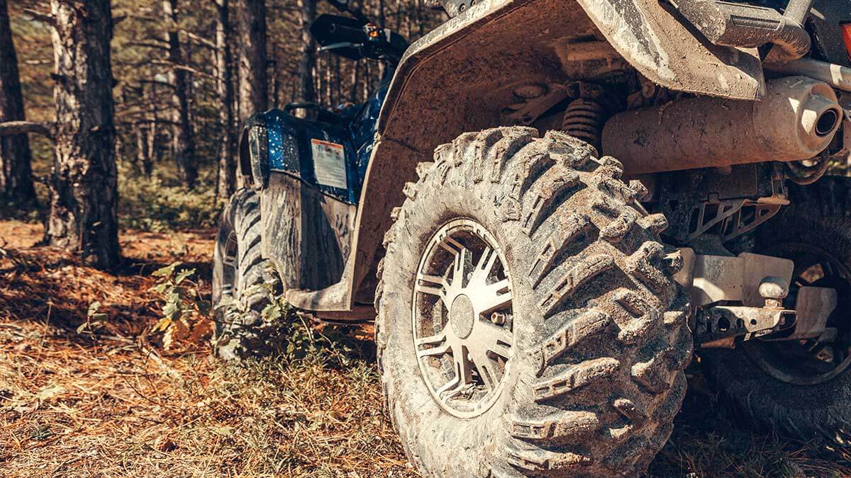 Closeup of an ATV in the woods