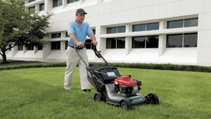 Men mowing the lawn with his brand new lawn mower around his house